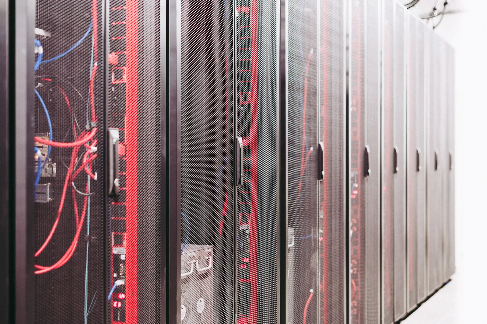 Server racks and network cabling in a data centre.